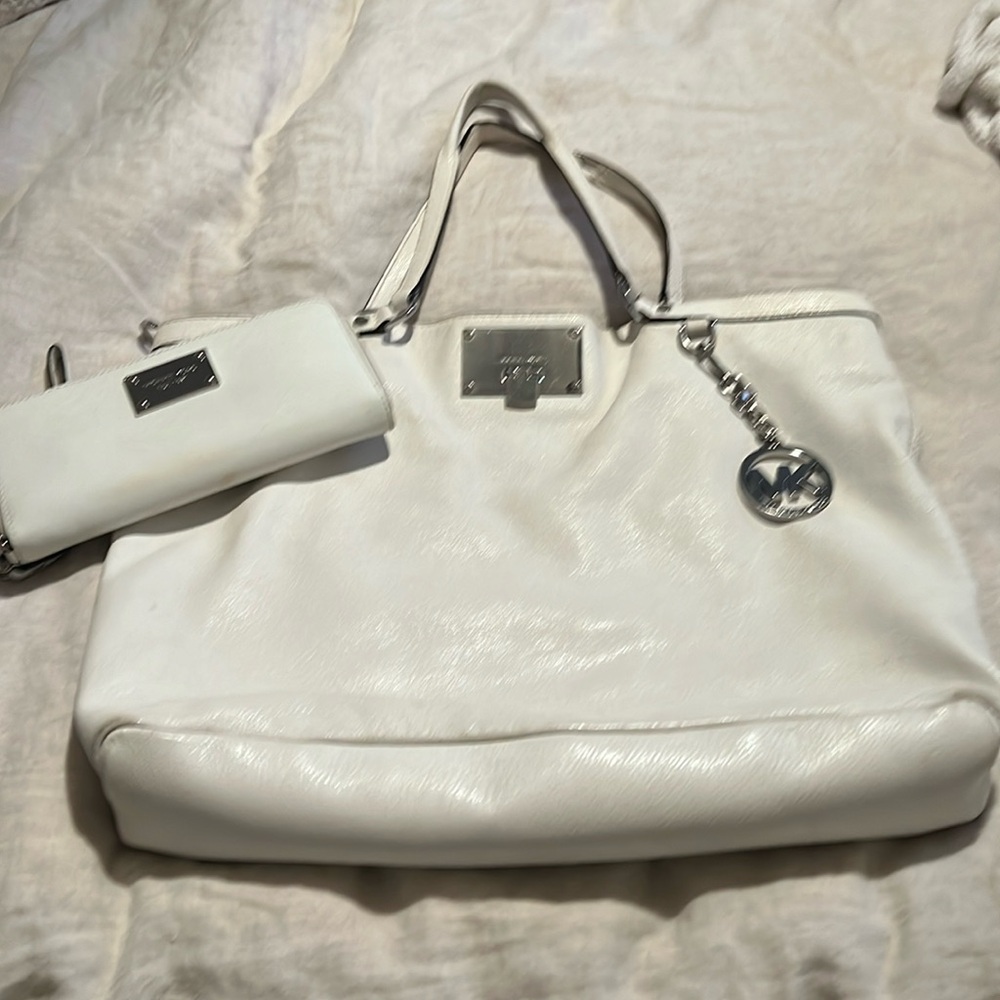 White Michael Kors leather bag and matching wallet/wristlet.